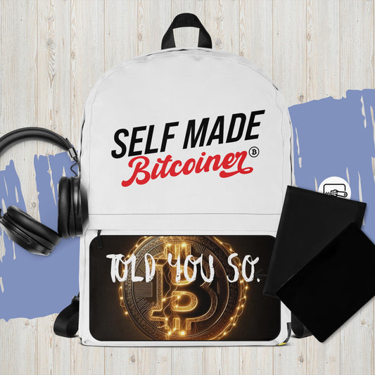 White Self Made Bitcoiner Backpack with HODL on the outside zipper area and bitcoin logos inside pocket & Bottom of backpack